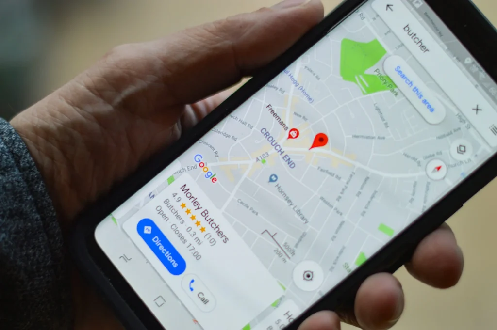 Smartphone displaying a map with a location pin, illustrating Google Business Profile visibility and local SEO optimization.